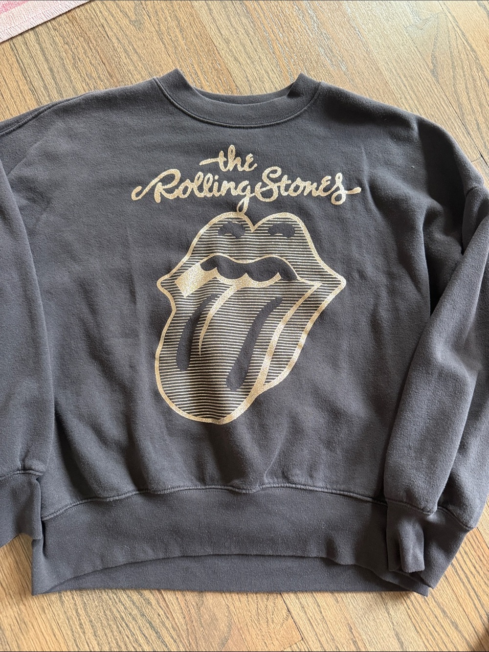 the Rolling Stones Black Sweatshirt with Gold Tongue Graphic
